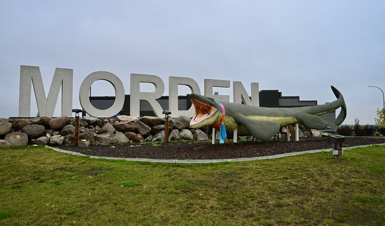 Bruce The Mosasaur wearing a Culture Days scarf outside the Canadian Fossil Discovery Centre. Photo courtesy of the City of Morden.