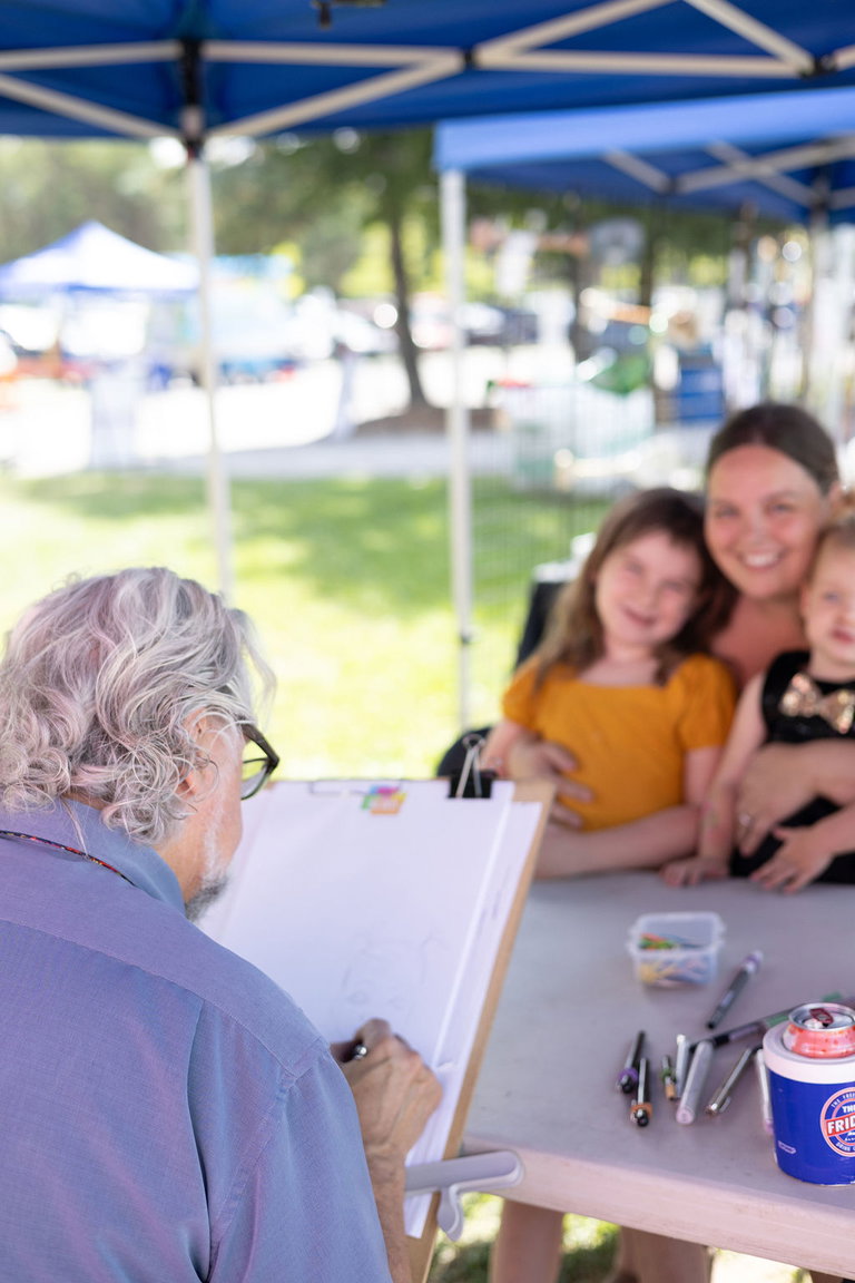 Attendees having their caricature sketched