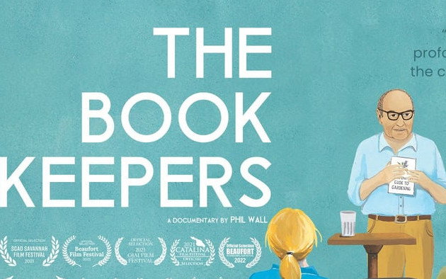 Image is a cropped version of The Book Keepers film poster.  It reads The Book Keepers, features an older white man wearing glasses and holding a book in front of an audience.  Below the title is a number of film awards.