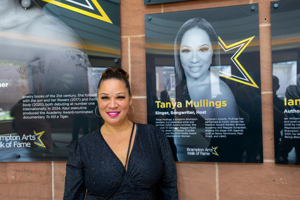Singer, Songwriting Tanya Mullings poses in front of her Arts Walk of Fame plaque