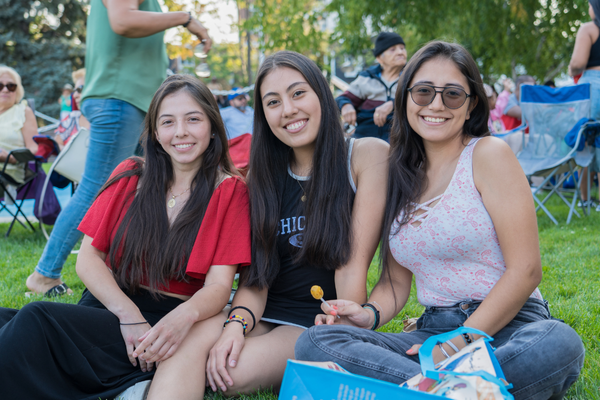 Three Latina women dancing at Ken Whillans Square at the Brampton Latin Festival