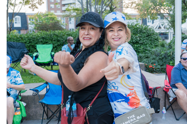 Two Latina women dancing at Ken Whillans Square at the Brampton Latin Festival