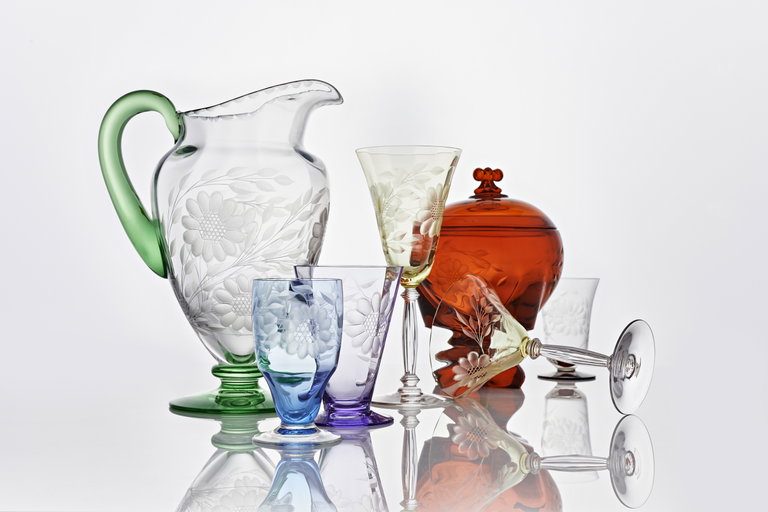 Several pieces of coloured glass in a plain background