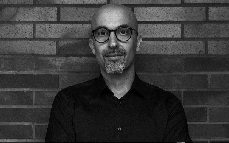 Black and white headshot of Amin Alsaden.