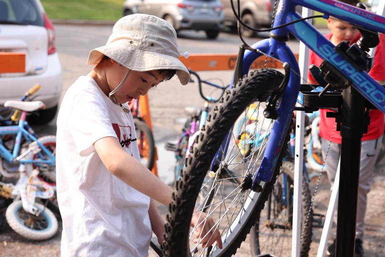 Participant fixing a bicycle