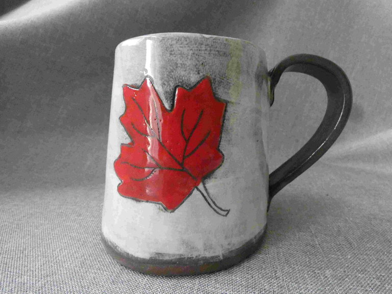 Grey mug with painted red maple leaf