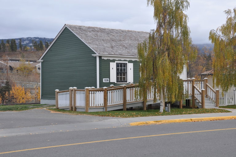 One story green house facing Front Street in Whitehorse