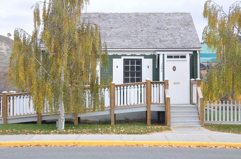 One story green house facing Front Street in Whitehorse