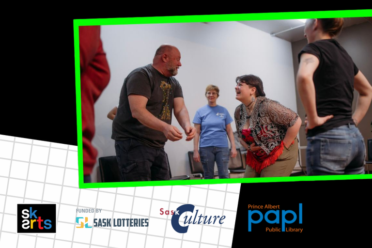 A group of people interact and laugh together during improve session