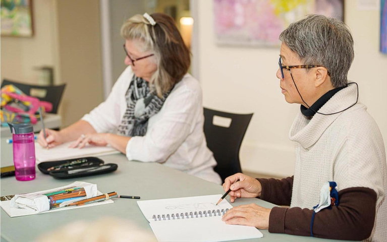 Two women drawing