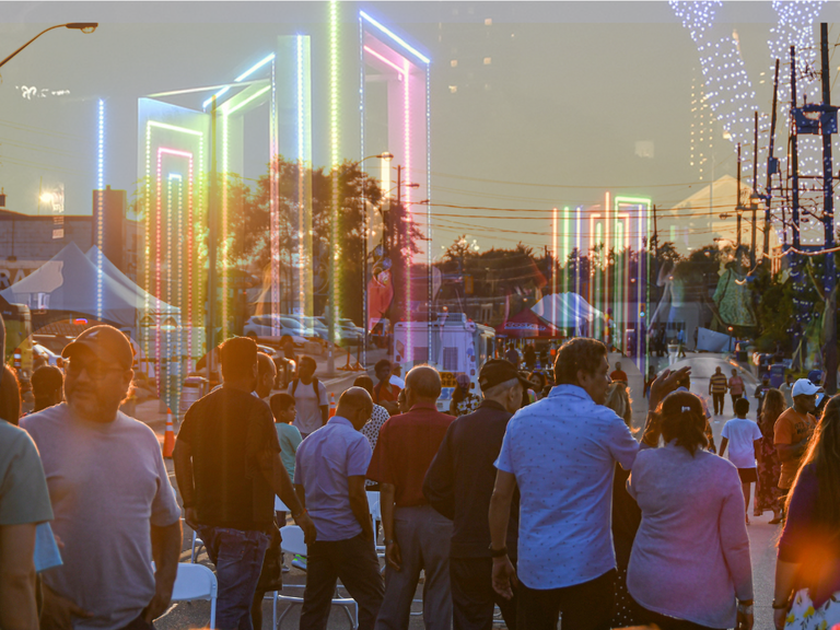 An image of crowds at a festival in Albion-Islington Square with a semi-transparent art installation layered over top to give a sense of the coming event.