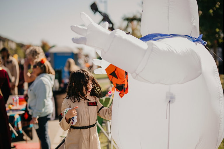 Girl playing with fidget and halloween decor