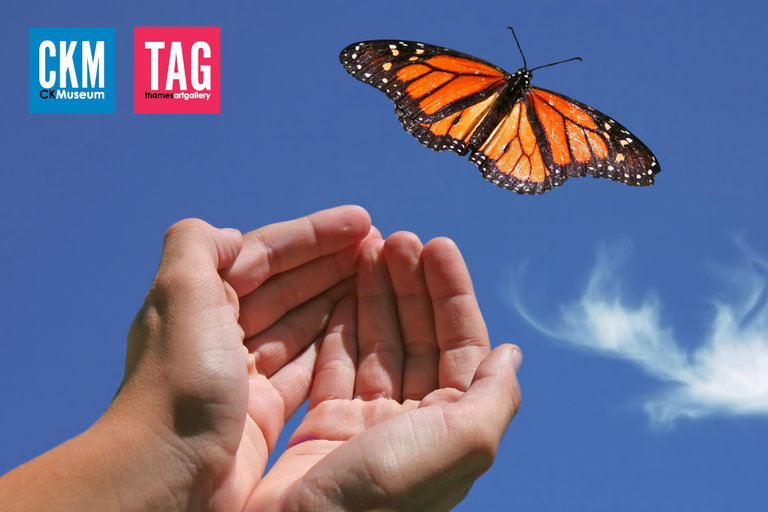 A blue sky with some wispy clouds. A cupped pair of open hands in the centre. A monarch butterfly flies just beyond the open hands. The Chatham-Kent Museum and Thames Art Gallery logos are in the upper left corner.