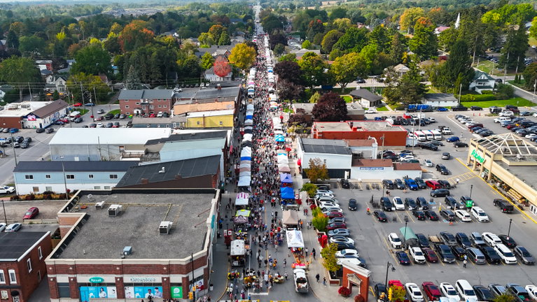 Aerial view of a busy downtown street full of people celebrating the apple harvest.