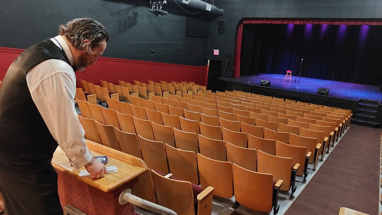 An usher getting ready for the show