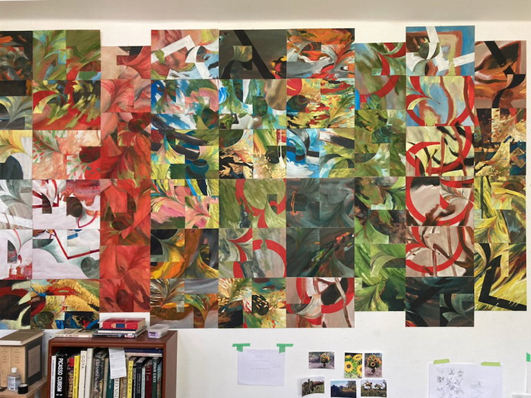 In-studio detail view of wall-sized abstract painting comprising many smaller paintings of various colours in sweeping strokes, fields, and funnelled forms