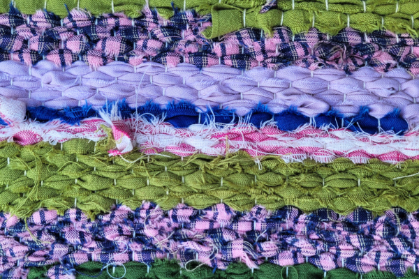 A weaving with multi-coloured fabric strips