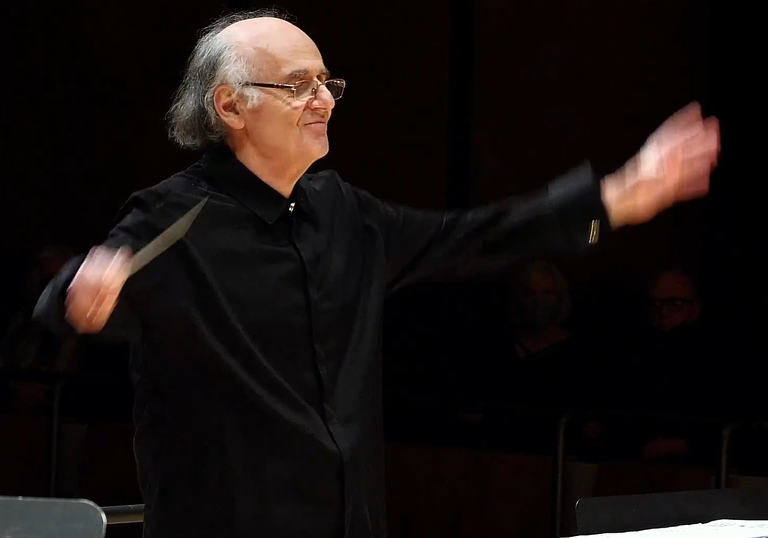 Conductor leading the music