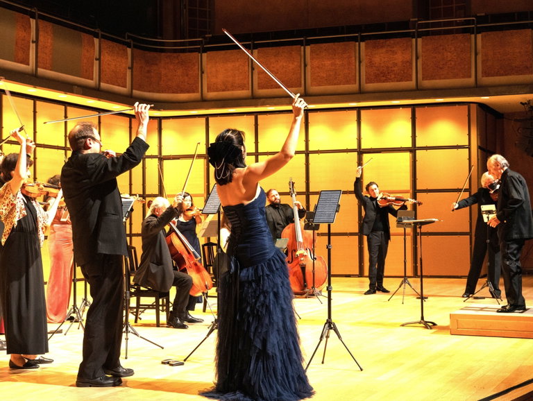 String orchestra after a selection's last chord