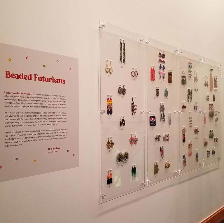 Beaded Nostalgia earring wall featuring 50 Indigenous artists from across Turtle Island