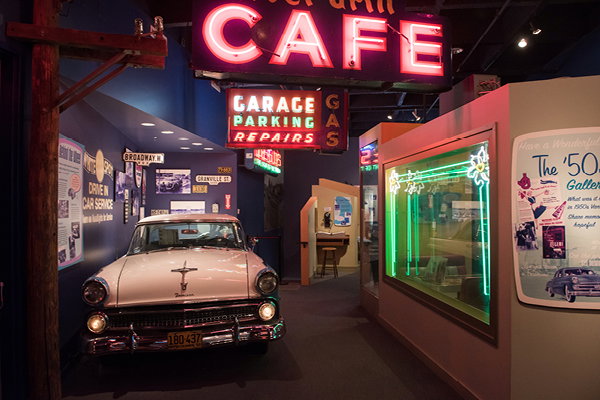 A view of the 1950s era gallery at the MOV including 1950s era car, neon signs and more.