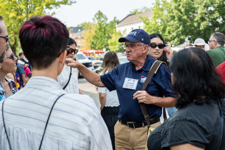 Museum guide giving a tour.