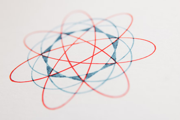 spirograph image in red and blue ink.