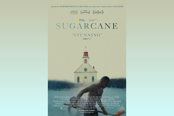 Image of a person with a shovel. In the background, a church looms. Text reads "Sugarcane"