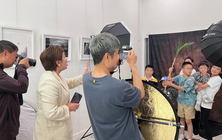 Participants collaborate to create a portrait in an artist studio.