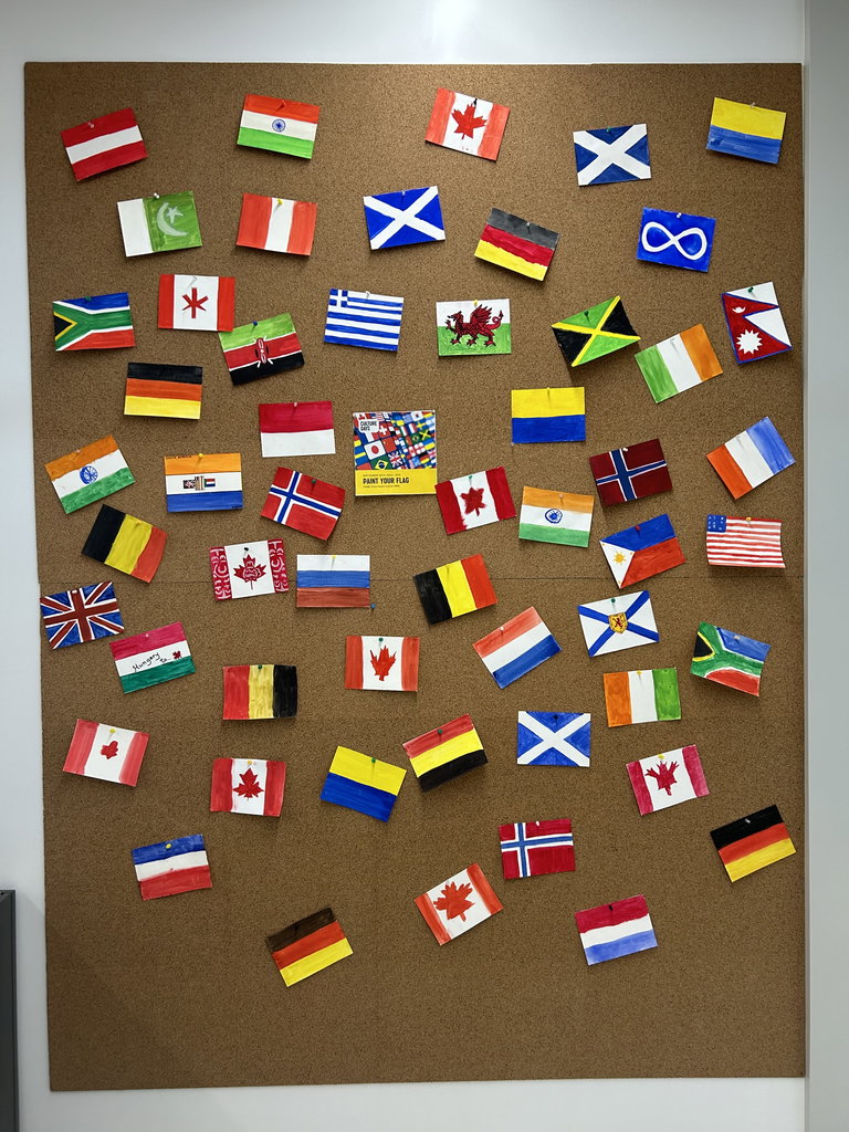 a variety of hand painted flag represent the various cultures of Weyburn
